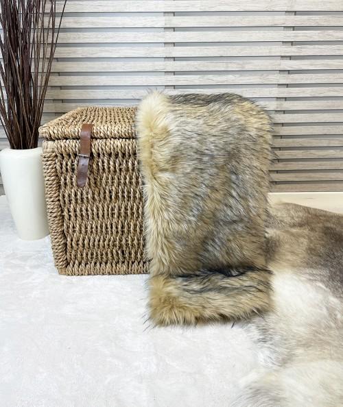 Beige, tan and black long haired fake fur blanket