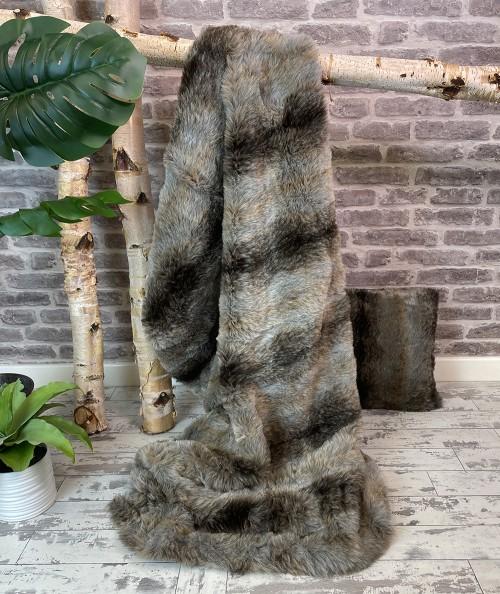 Grey and brown striped fake fur throw and cushion