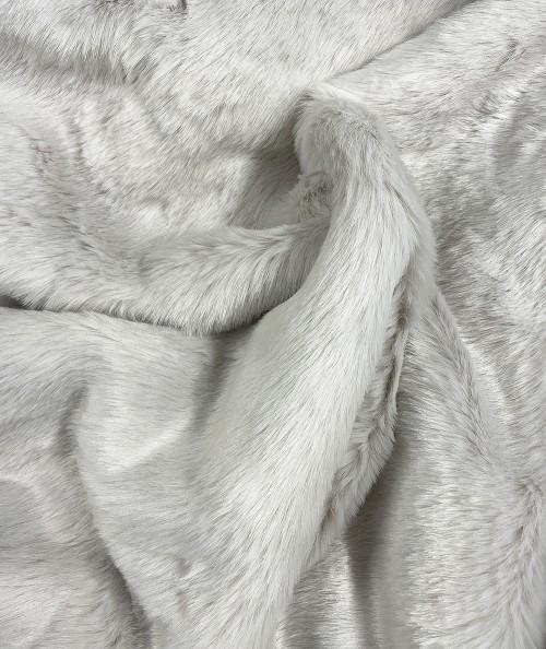 Close up image of pale silvery white luxury faux fur fabric