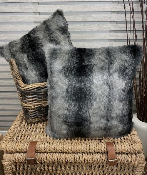 Square cushions in striped black and grey fur