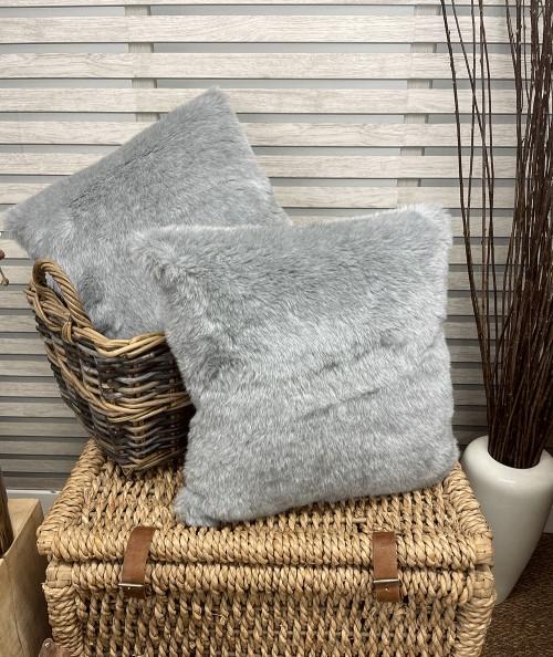 Light grey furry cushion covers