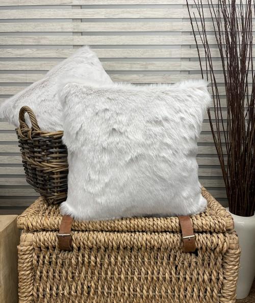 Light coloured faux fur cushions