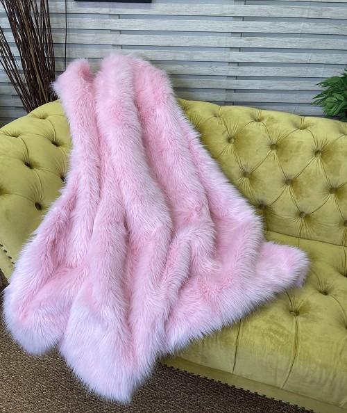 Modern pink coloured faux fur sofa throw