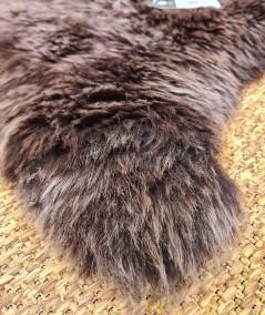 Close up image of the chocolate brown sheepskin rug