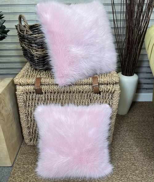 Modern pastel pink fluffy fur cushions